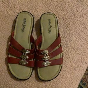 Minnetonka size 6 red sandals with beautiful silver ornate decor. New condition